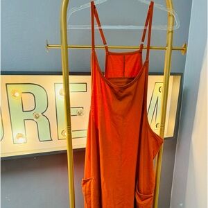 orange baggy jumper with adjustable straps
